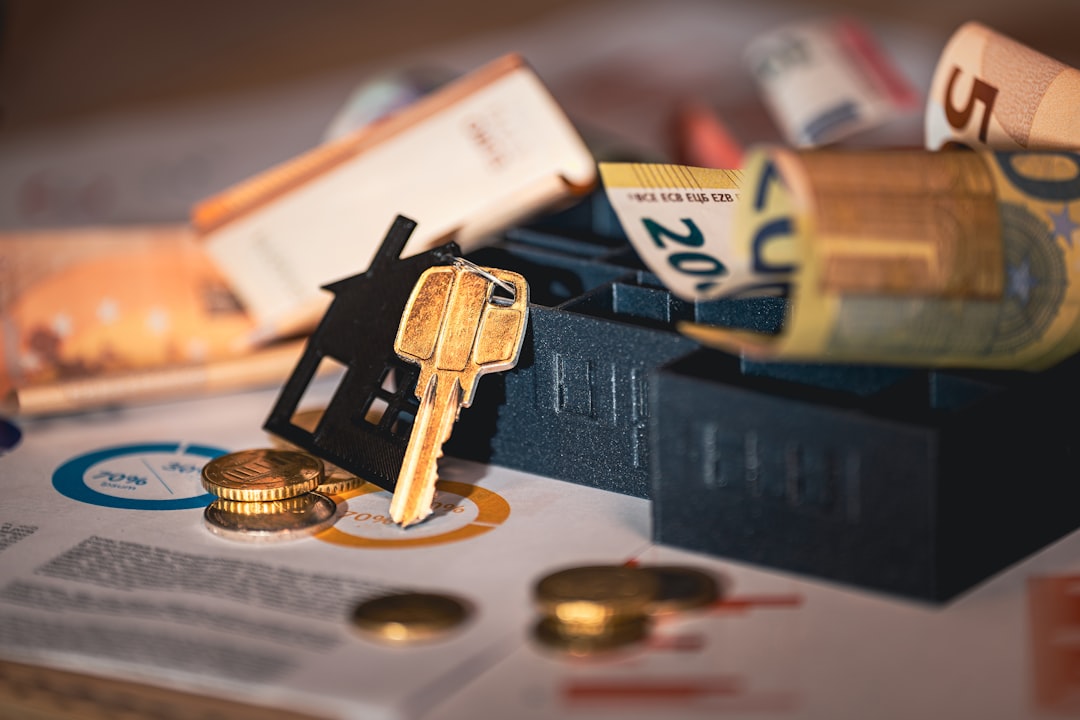 Close-up shot of a magnifying glass hovering over a document, symbolizing the scrutiny of a real estate contract, with hou...